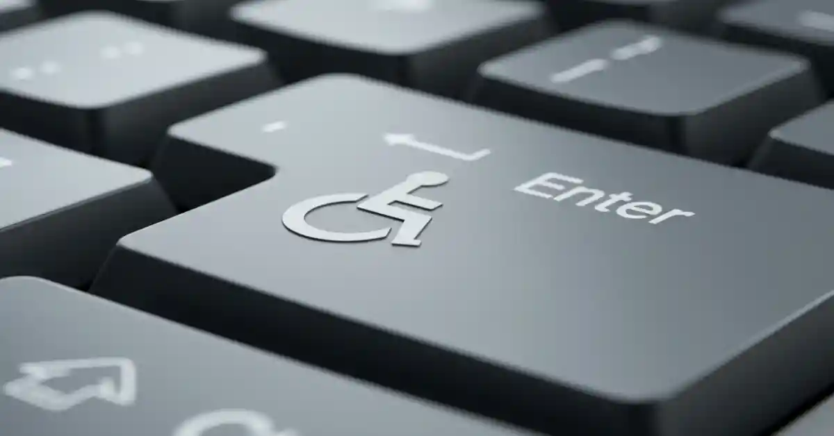 Criação de sites acessíveis para empresas. Símbolo de acessibilidade web no teclado